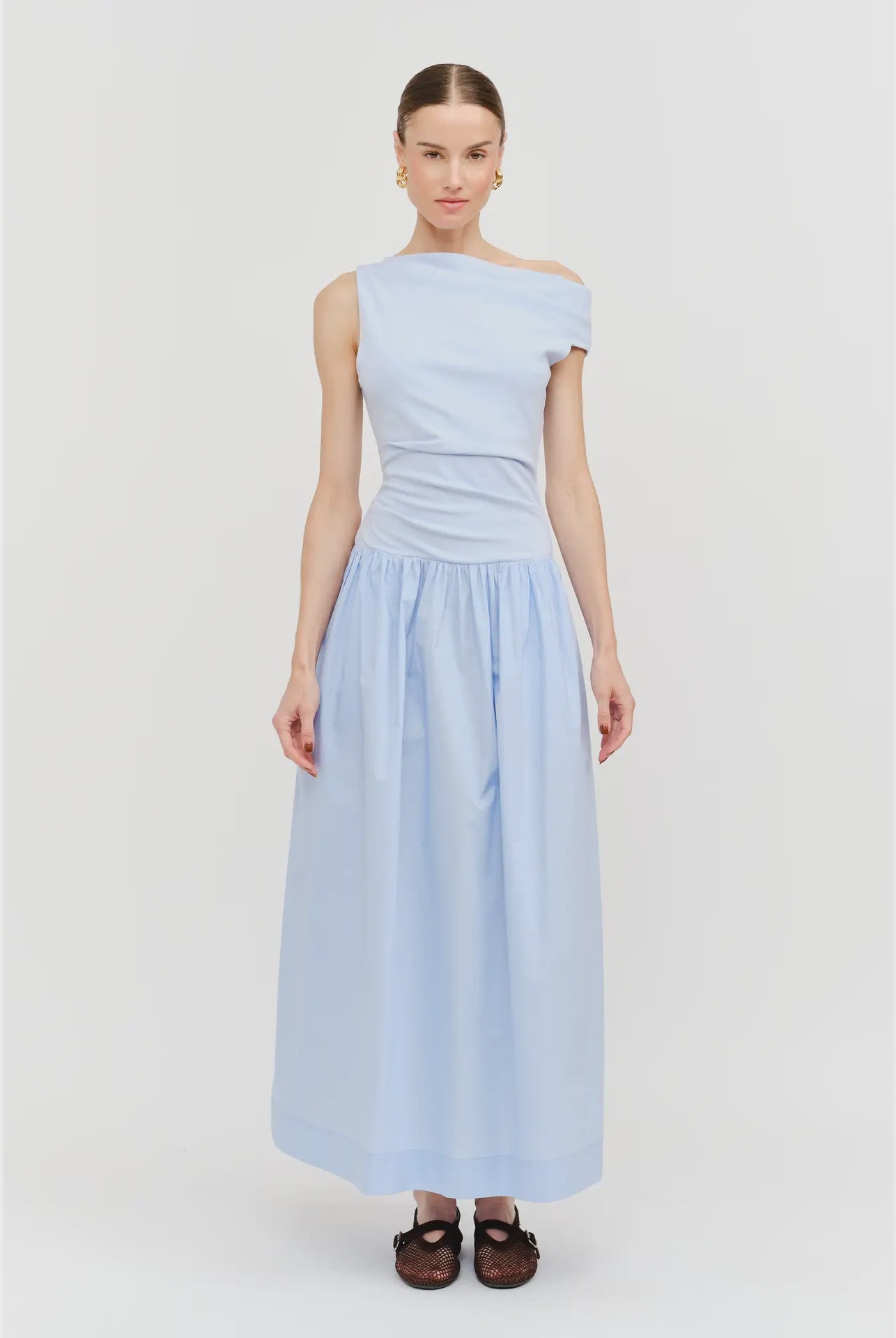 woman wearing light blue sleeveless off the shoulder maxi dress