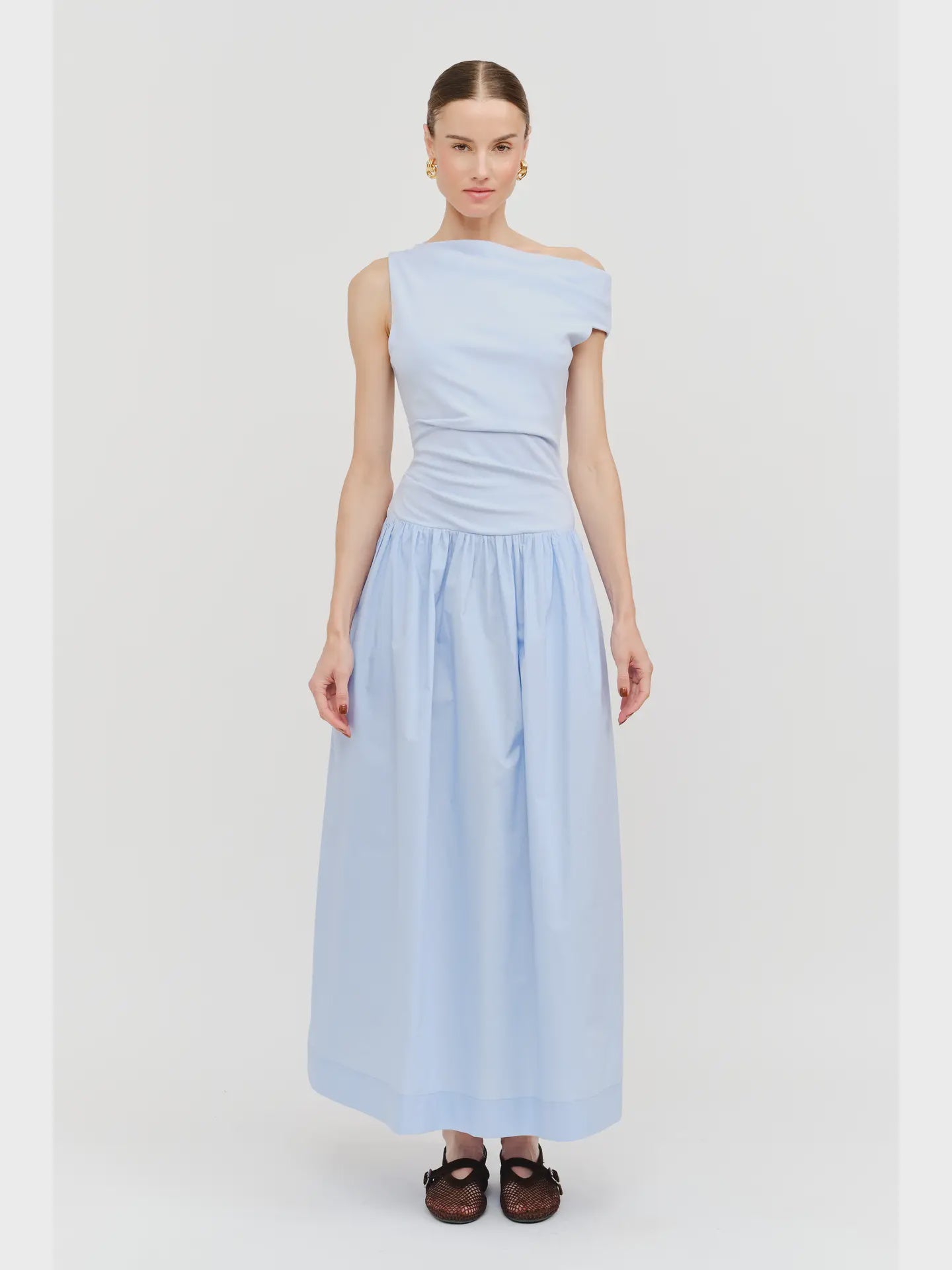 woman wearing light blue sleeveless off the shoulder maxi dress