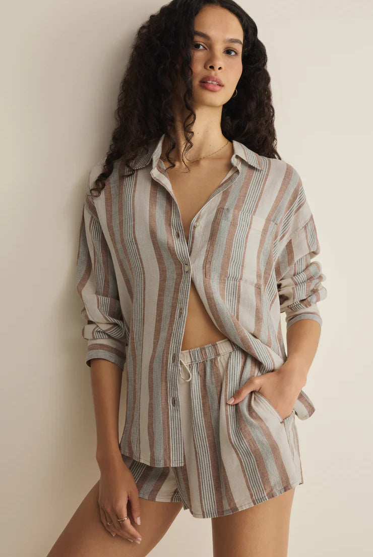 Woman wearing a neutral striped shirt and shorts set. Female Clothing Store Ontario Small Business