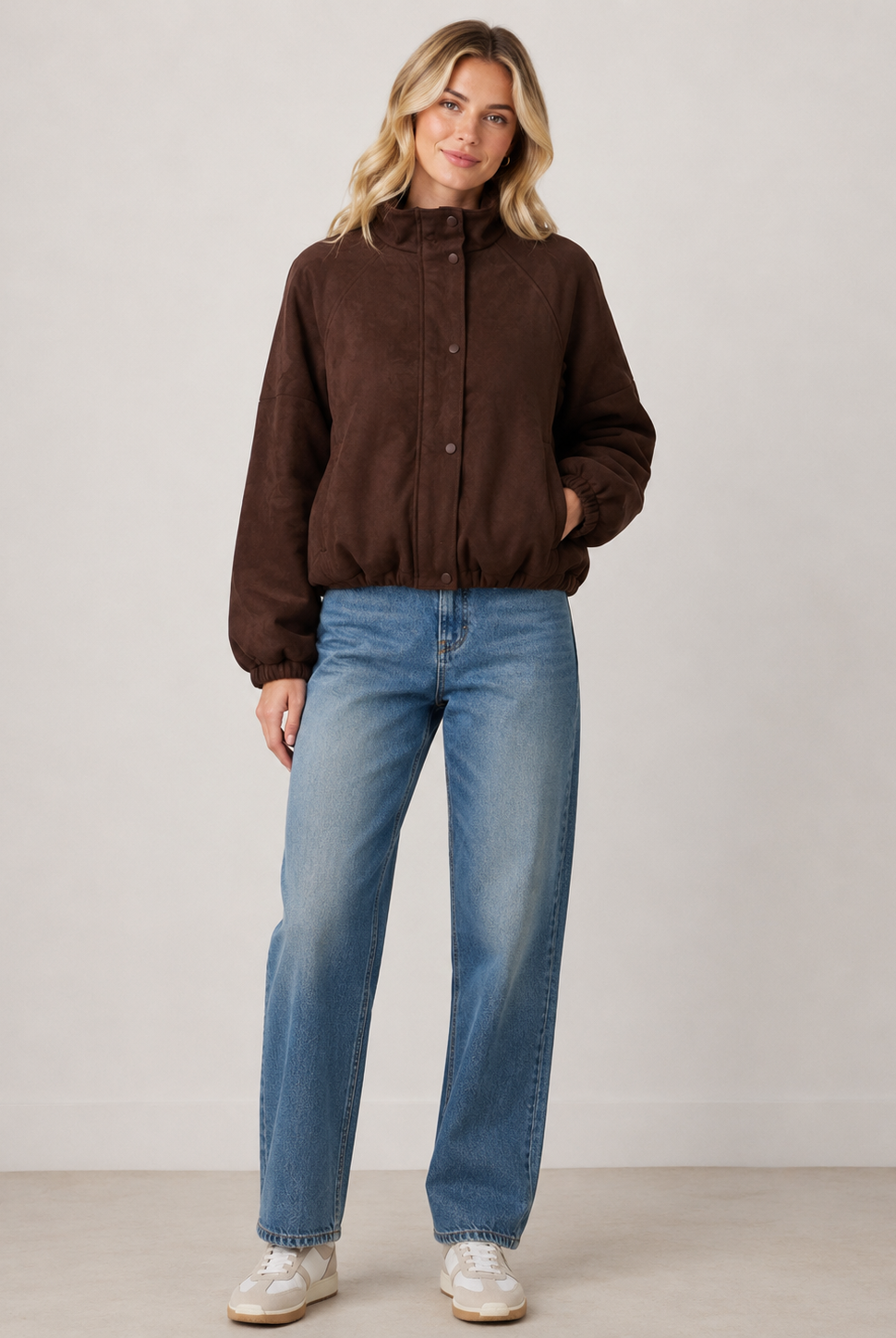 Chocolate brown faux suede bomber jacket featuring a relaxed fit, high funnel neckline, snap-button front closure, elasticated cuffs and hem, and functional side pockets for a polished everyday layering piece.