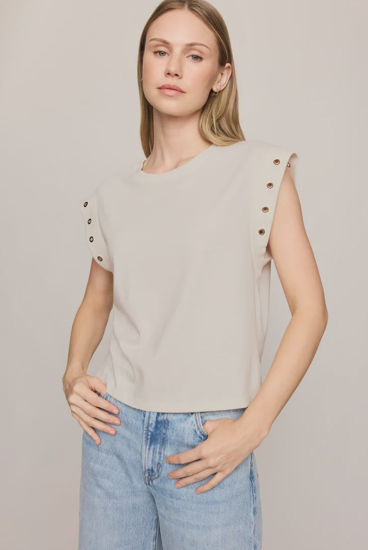 Relaxed muscle tee in soft cotton-blend jersey with gold metal grommet details at the arm openings. An elevated everyday basic with an effortless drape and versatile, modern silhouette.