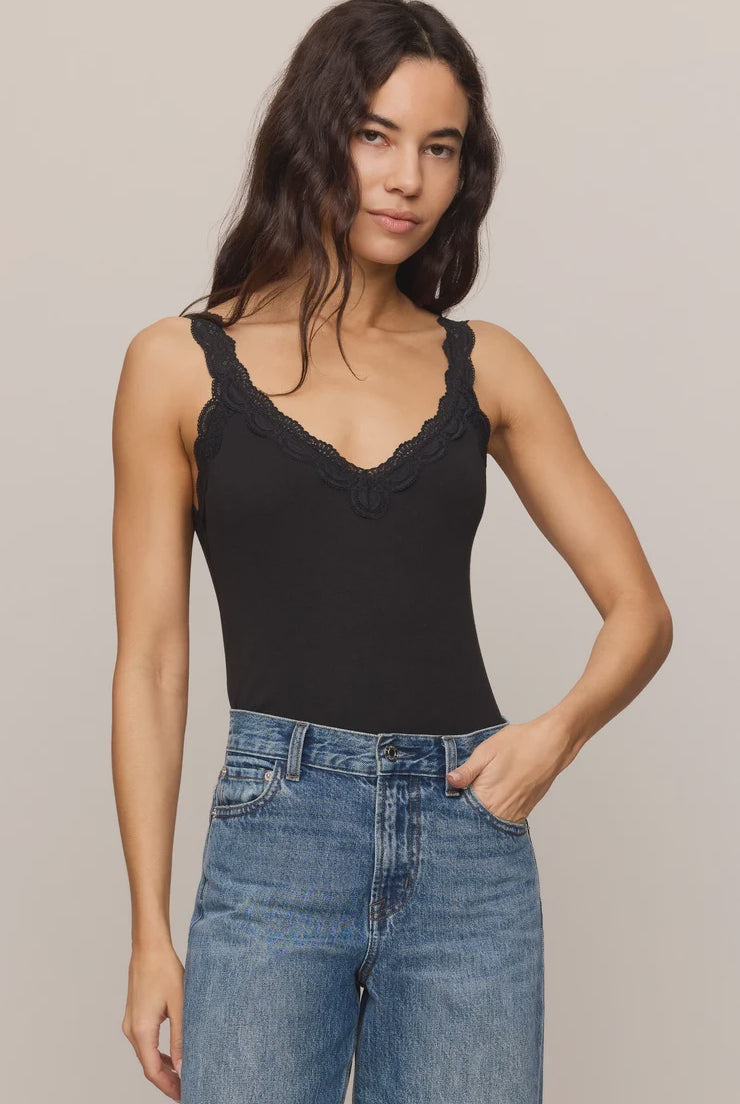 Fitted baby rib cotton tank with a lace-trimmed V-neckline and wide straps. A soft, feminine essential that's perfect for layering or wearing on its own.