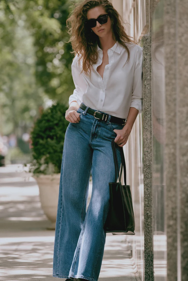 High-rise wide-leg jeans in a vintage-inspired blue wash, featuring a subtle twisted seam, full-length legs, and classic five-pocket styling.