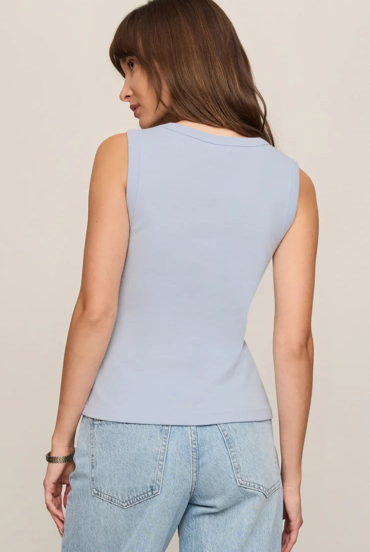 Model wearing the Z Supply Ellie V-Neck Tank, a sleeveless ribbed cotton tank featuring a flattering V-neckline, wide bra-friendly straps, and a fitted silhouette. The versatile essential is styled with casual bottoms for an effortless everyday look.