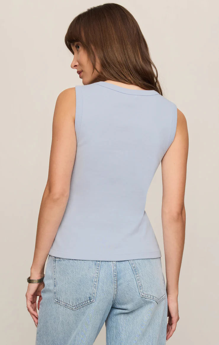 Model wearing the Z Supply Ellie V-Neck Tank, a sleeveless ribbed cotton tank featuring a flattering V-neckline, wide bra-friendly straps, and a fitted silhouette. The versatile essential is styled with casual bottoms for an effortless everyday look.