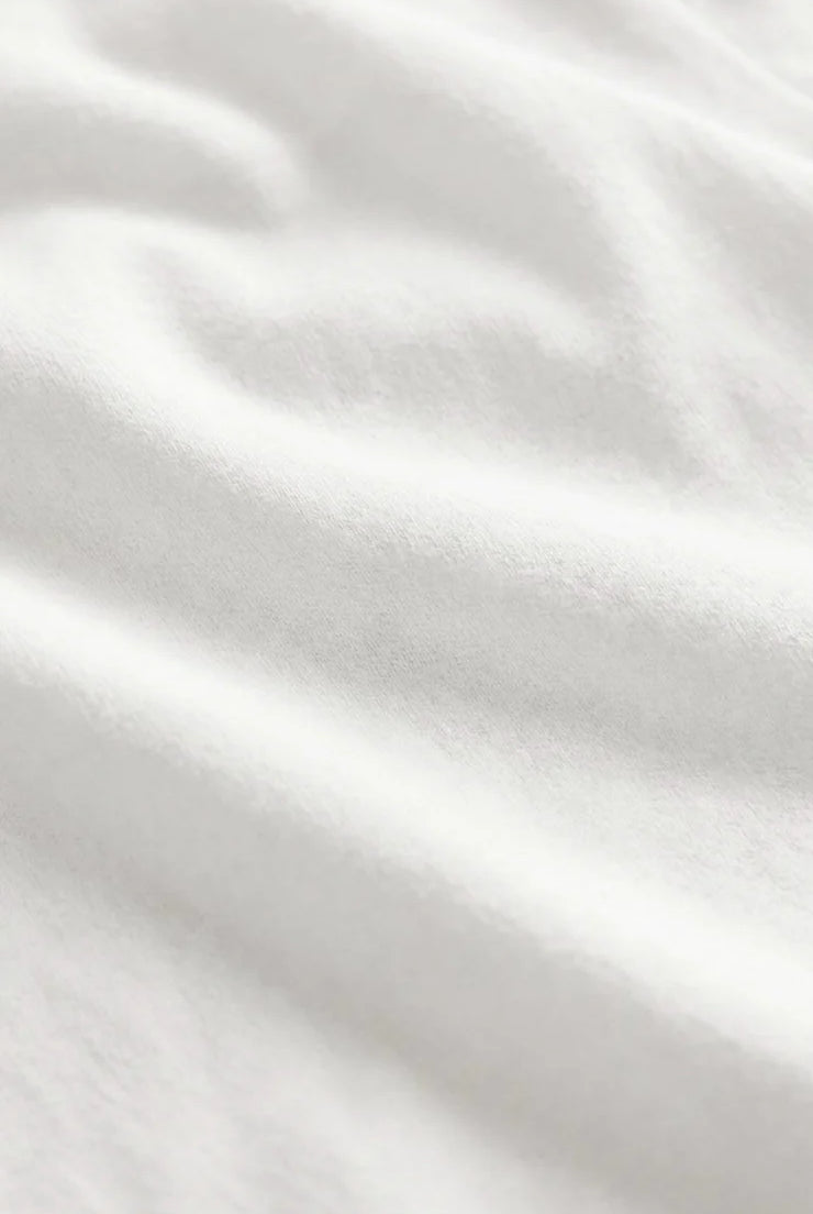 Close-up of the Z Supply Ellie V-Neck Tank's soft 100% cotton baby rib fabric, highlighting its fine ribbed texture, smooth finish, and comfortable stretch with a substantial yet breathable feel.