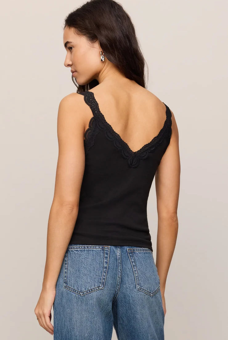 Fitted baby rib cotton tank with a lace-trimmed V-neckline and wide straps. A soft, feminine essential that's perfect for layering or wearing on its own.