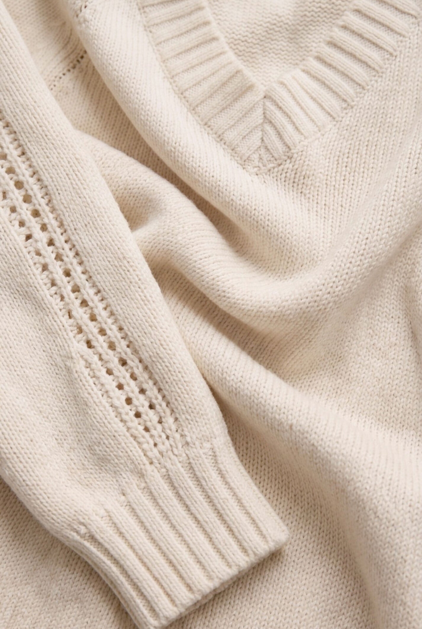 Close-up of the Z Supply Stratton V-Neck Sweater in Sandstone highlighting the soft 100% cotton Sienna Yarns knit, V-neckline, and fine knit texture.