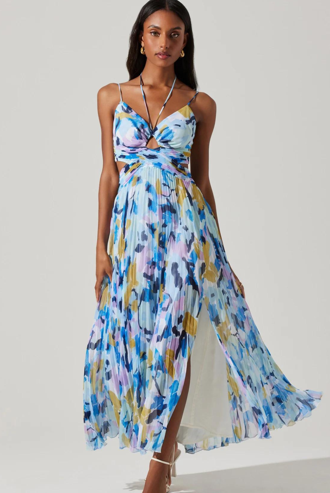 ASTR The Label Aquata Floral Maxi Dress. Front V-neck strappy detail, keyhole cutout Halter tie straps, plisse fabrication, side cutouts Side slit, hidden back zipper closure.