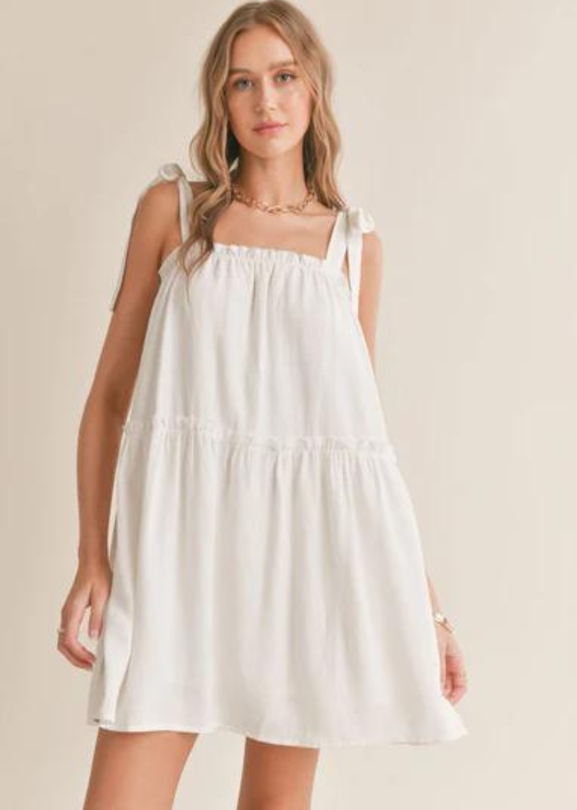 Sadie & Sage Sugarloaf Tiered Dress. Feel effortlessly stylish in our Sugarloaf Tiered Dress with Tie Straps! The tiered design and tie straps add a playful touch to this comfortable and versatile dress. Perfect for any occasion, this dress is a must-have for your wardrobe.