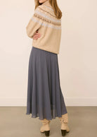 Arianna bias-cut chiffon skirt with a flattering high-rise fit, soft fluid drape, and an elastic waistband finished with delicate scalloped trim. Fully lined for comfortable wear and available in Smoke and Black.