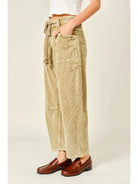 Women’s camel corduroy trousers featuring a subtle barrel fit, utility patch pockets, belt loops, and a rope tie waist.