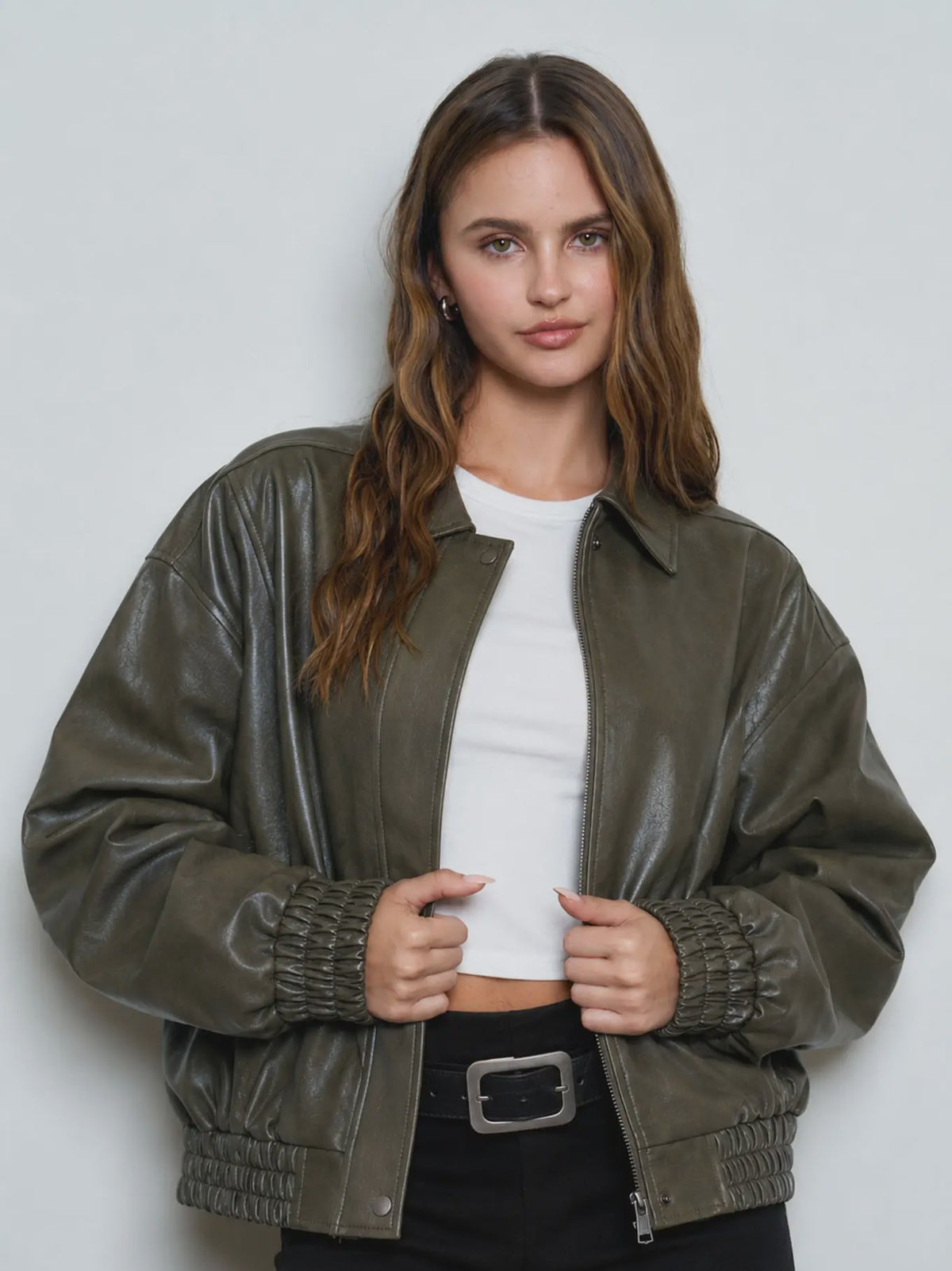 Women’s olive collared bomber jacket featuring a relaxed fit, zip-front closure, long sleeves, and gathered elastic cuffs and hem.