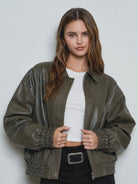 Women’s olive collared bomber jacket featuring a relaxed fit, zip-front closure, long sleeves, and gathered elastic cuffs and hem.