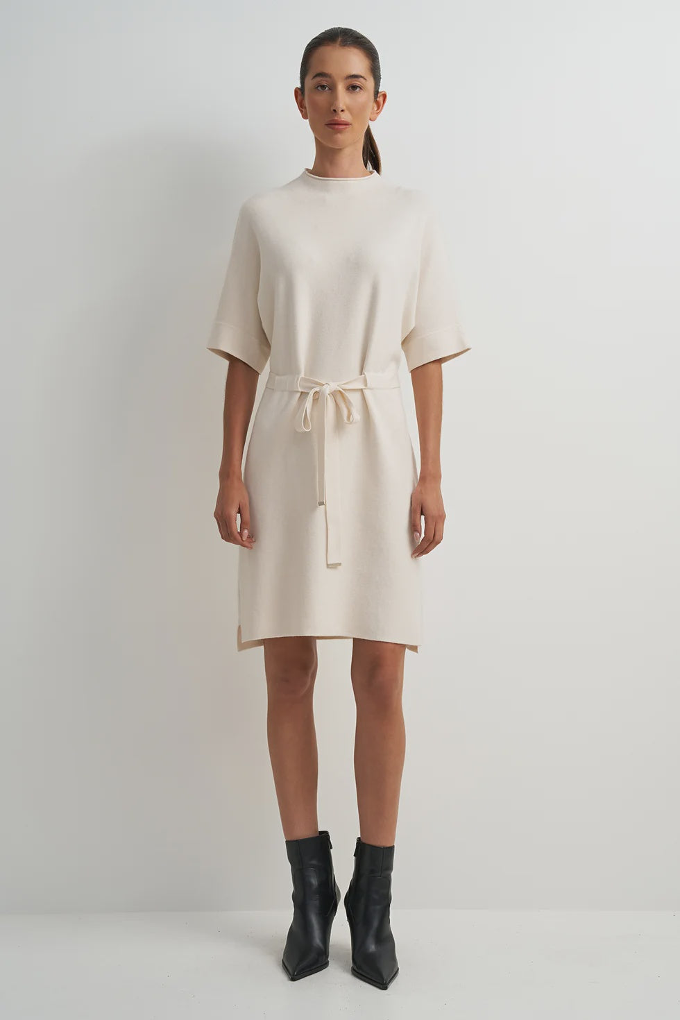 Cream viscose-blend midi dress with a flattering feminine silhouette, clean lines, and an easy, flowy fit.
