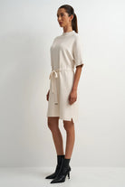 Cream viscose-blend midi dress with a flattering feminine silhouette, clean lines, and an easy, flowy fit.
