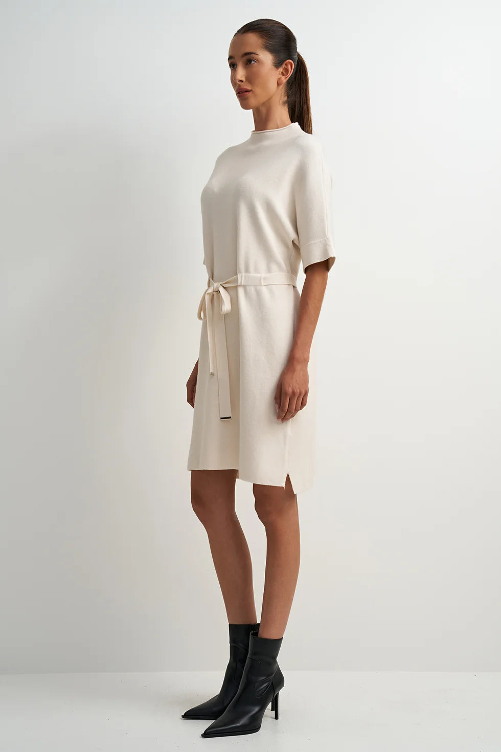 Cream viscose-blend midi dress with a flattering feminine silhouette, clean lines, and an easy, flowy fit.
