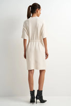 Cream viscose-blend midi dress with a flattering feminine silhouette, clean lines, and an easy, flowy fit.

