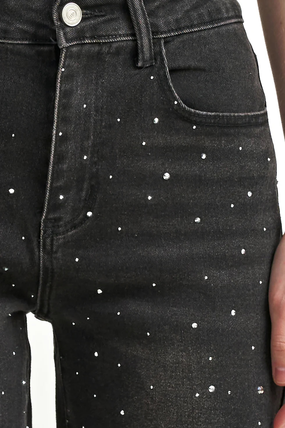 Washed black denim jeans with a flattering leg and rhinestone detailing, adding a subtle western-inspired touch.