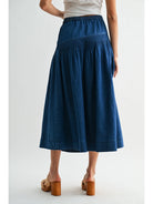 Heritage Midi Denim Skirt in classic blue denim, featuring a high-waisted fit and softly flared silhouette.
