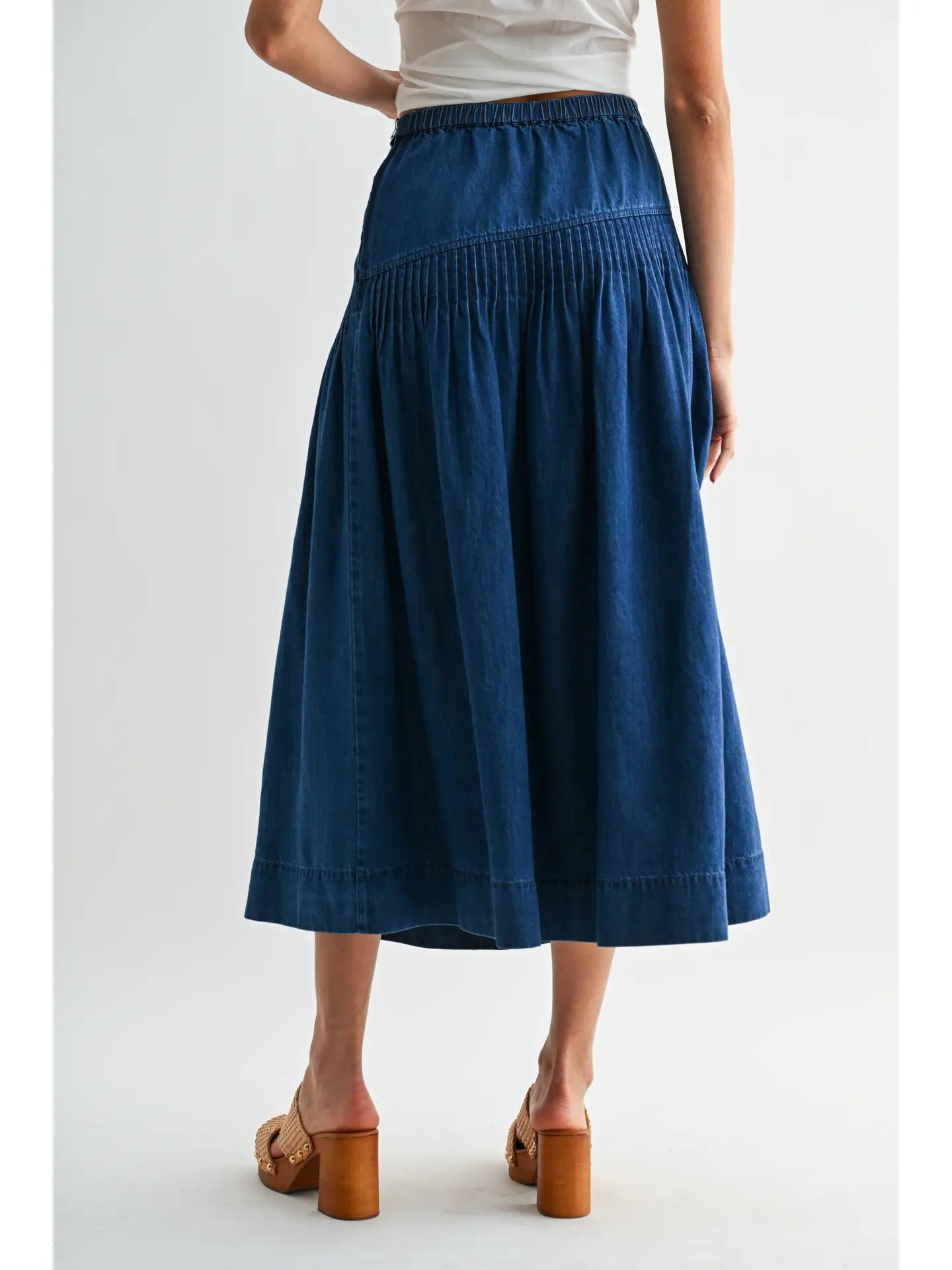 Heritage Midi Denim Skirt in classic blue denim, featuring a high-waisted fit and softly flared silhouette.
