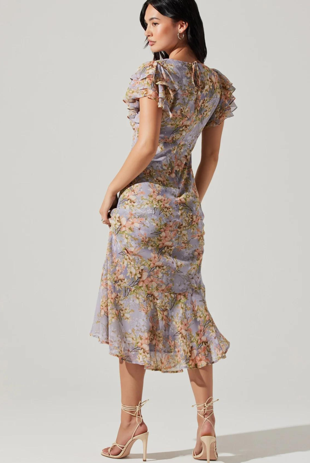 ASTR The Label Celestine Dress. V-neckline, floral print and flutter sleeves Midi length, tie neck detail, concealed back zipper