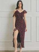 Polka dot maxi dress featuring a wide V-neckline, asymmetrical cascading ruffle details, open back, adjustable shoulder straps, hidden center-back zipper, and fully lined interior.