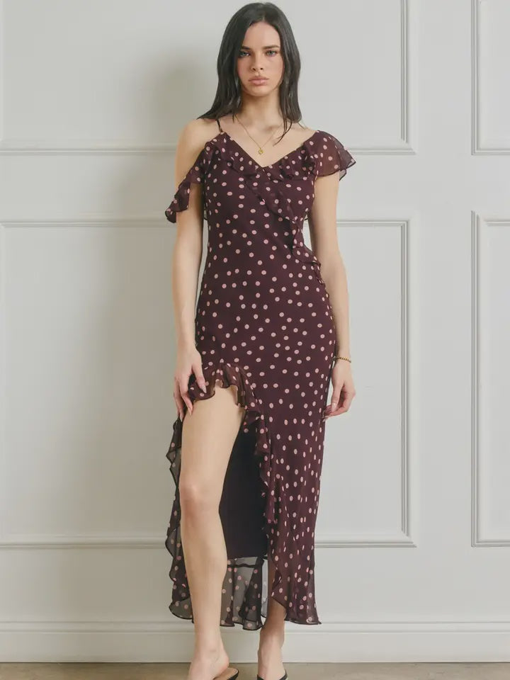 Polka dot maxi dress featuring a wide V-neckline, asymmetrical cascading ruffle details, open back, adjustable shoulder straps, hidden center-back zipper, and fully lined interior.