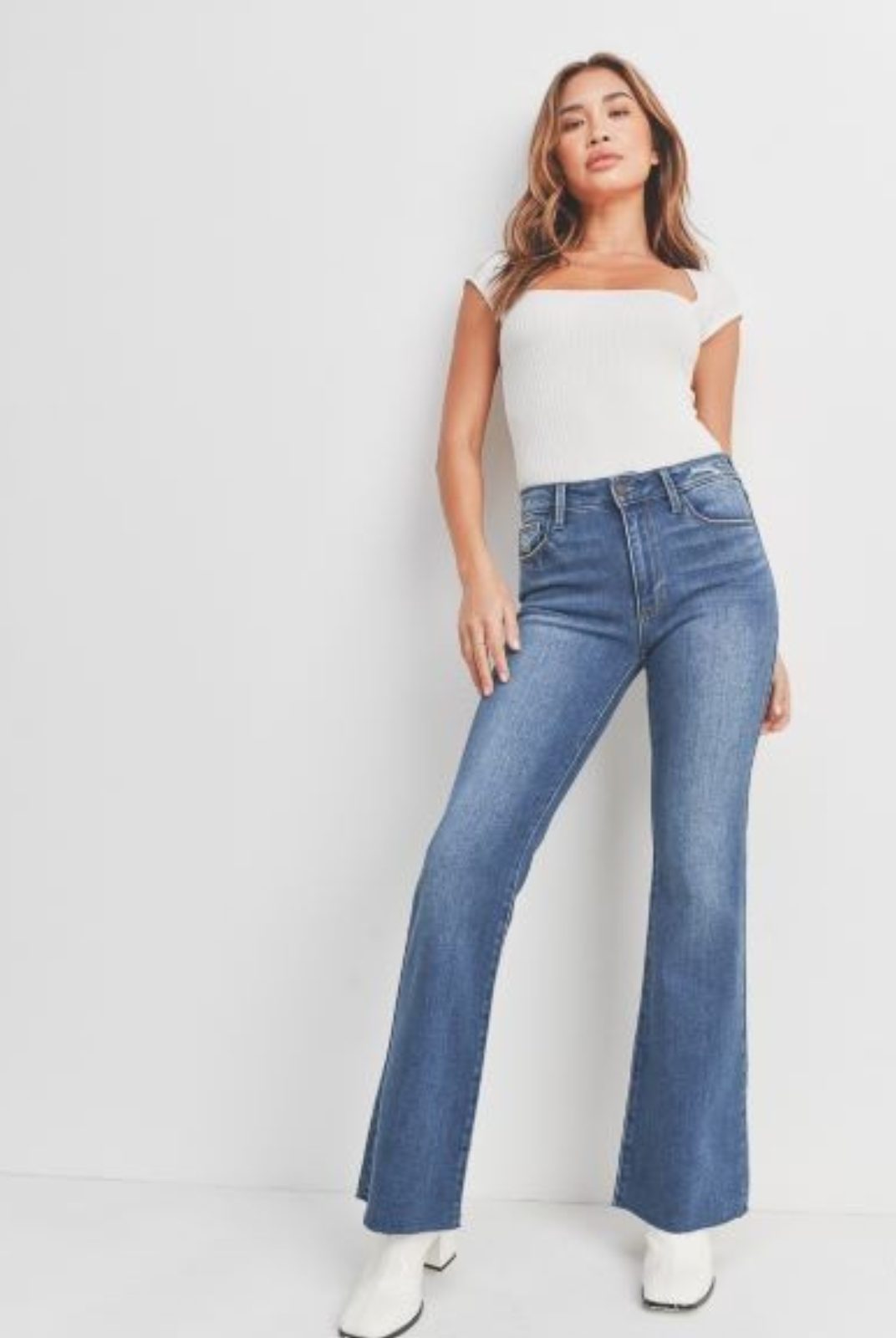 Just Black Flare Jean. Get ready to fall in love with our favorite jean of the season. We took this classic silhouette, and gave it an updated wash and scissor cut hem to make it the ultimate jean for dressing up and dressing down.