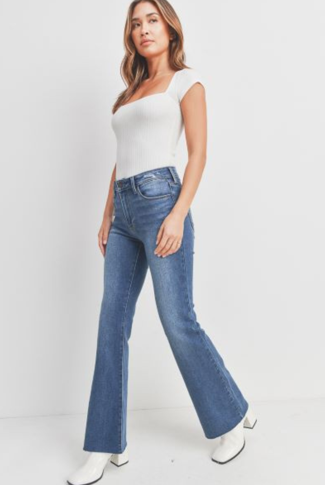 Just Black Flare Jean. Get ready to fall in love with our favorite jean of the season. We took this classic silhouette, and gave it an updated wash and scissor cut hem to make it the ultimate jean for dressing up and dressing down.