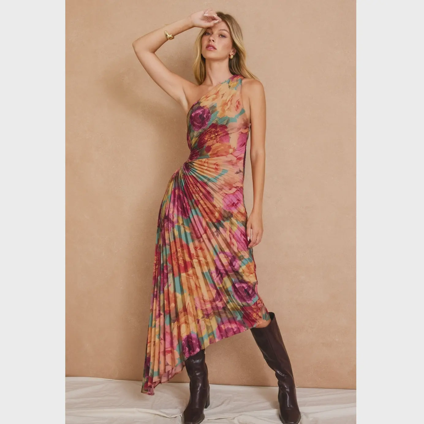 Romantic floral satin maxi dress featuring a pleated one-shoulder neckline, asymmetrical hemline, side keyhole detail, hidden side zipper closure, and fully lined interior.