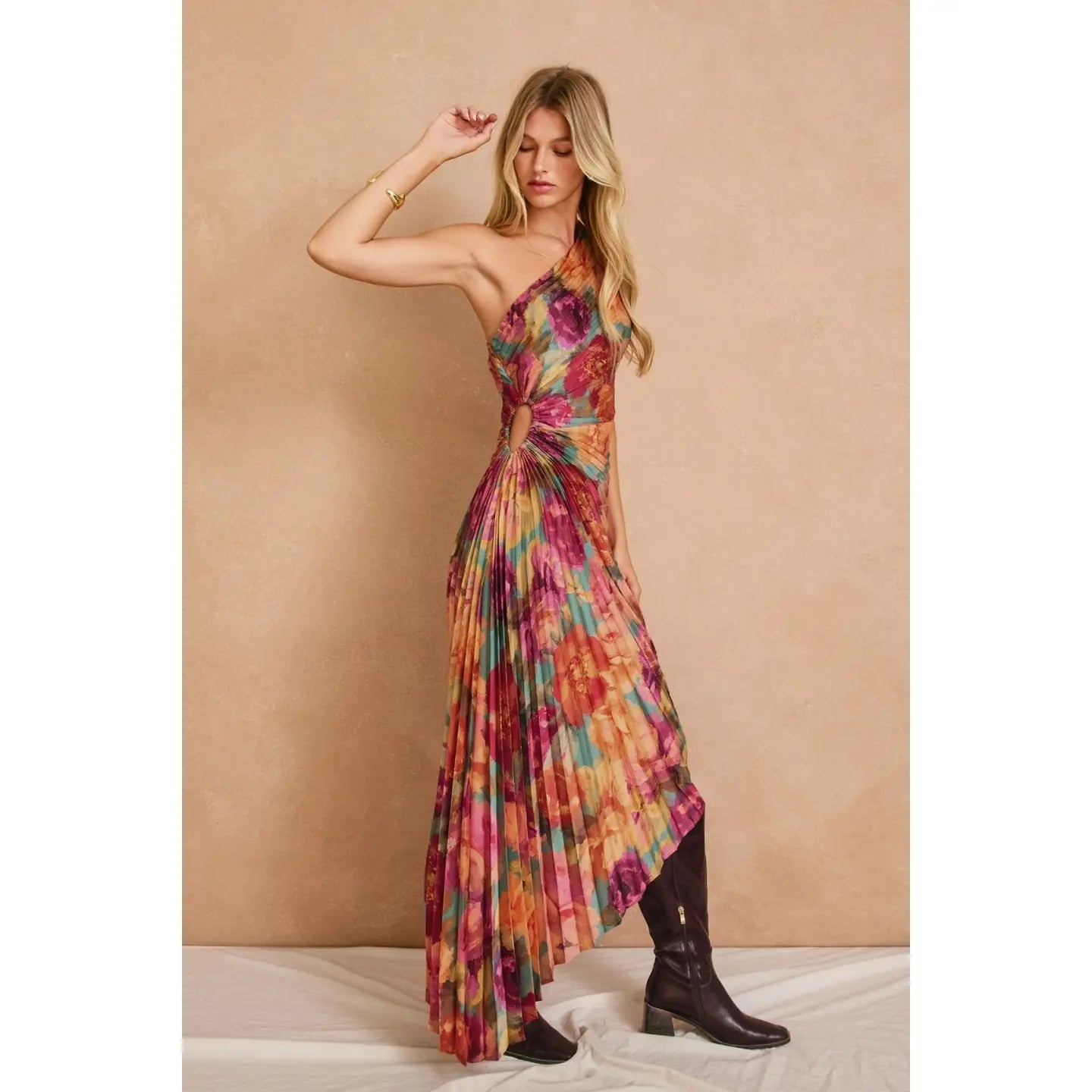 Romantic floral satin maxi dress featuring a pleated one-shoulder neckline, asymmetrical hemline, side keyhole detail, hidden side zipper closure, and fully lined interior.