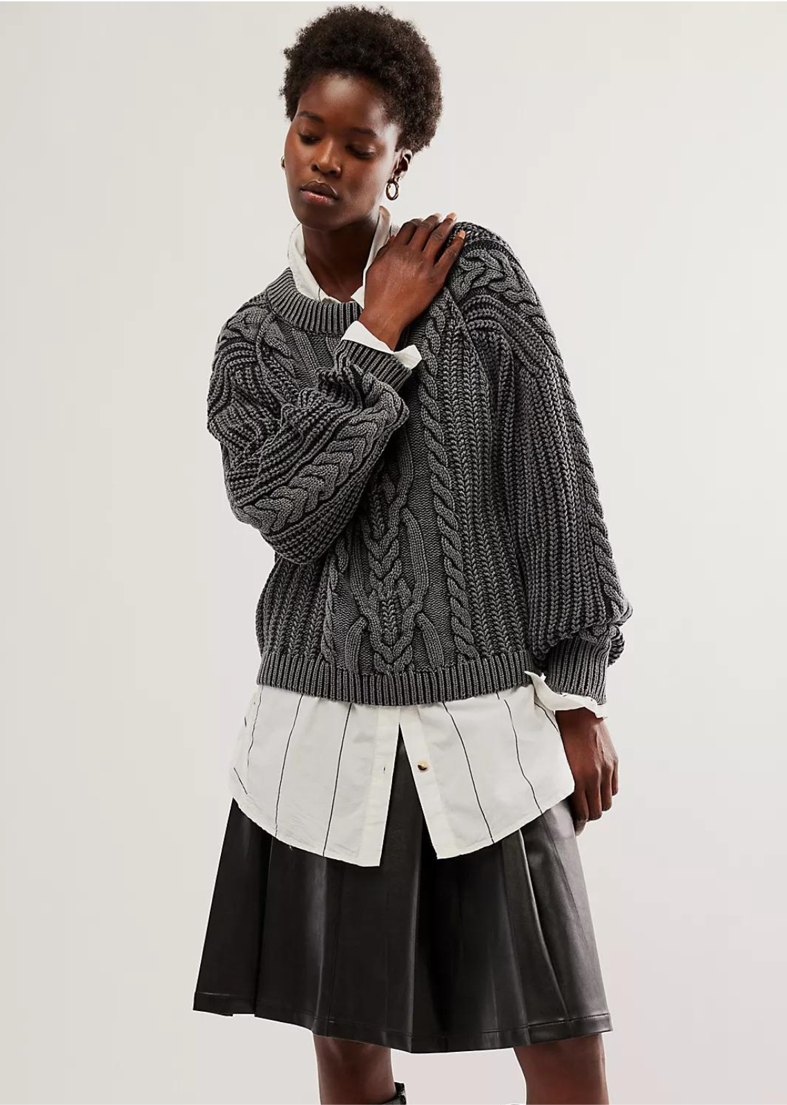 Free People Frankie Cable Sweater- Black A new take on a forever classic, this staple sweater is featured in a chunky knit fabrication with timeless cable detailing throughout for an added special touch.