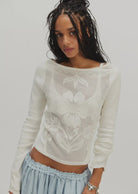Deliah Long Sleeve top featuring a softly draped off-the-shoulder neckline, long fitted sleeves, and a flattering body-skimming silhouette with an elegant, feminine finish.