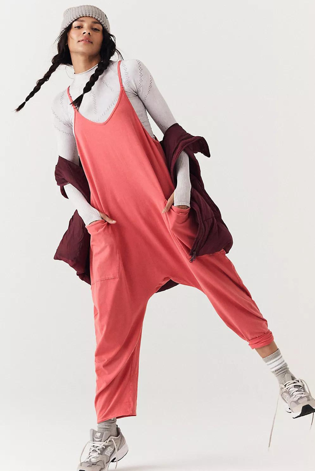 Free People Hot Shot Onesie- Red. This soft and comfy onesie features a slouchy, relaxed-fitting design with a dropped crotch and convenient side pockets.