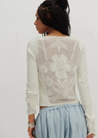 Deliah Long Sleeve top featuring a softly draped off-the-shoulder neckline, long fitted sleeves, and a flattering body-skimming silhouette with an elegant, feminine finish.