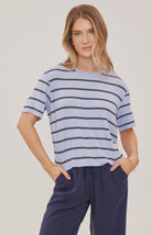 Women's relaxed oversized crewneck t-shirt featuring sky blue and white stripes, crafted from soft jersey knit with short sleeves and a comfortable oversized silhouette.