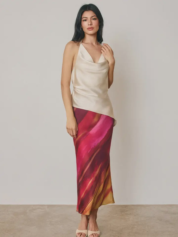 Golden Hour A-line maxi skirt in a watercolor-inspired stripe print with a smooth satin finish, featuring a hidden elastic waistband, pull-on design, and partial lining.