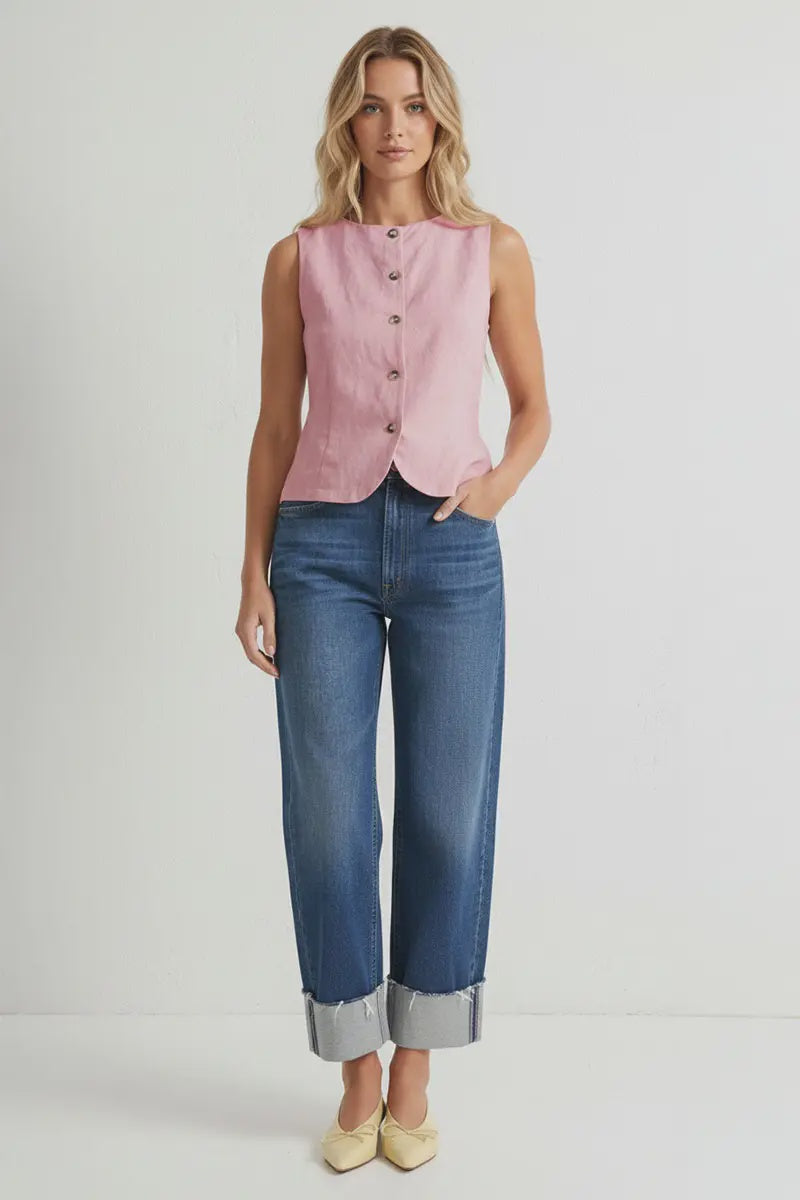 Light pink sleeveless woven vest featuring a round neckline, button-front closure, curved hem, and a tailored fit. Designed with an adjustable tie-back detail for a flattering, customizable silhouette