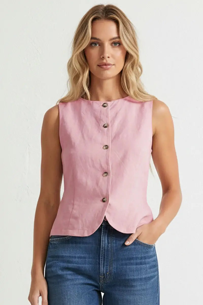 Light pink sleeveless woven vest featuring a round neckline, button-front closure, curved hem, and a tailored fit. Designed with an adjustable tie-back detail for a flattering, customizable silhouette.