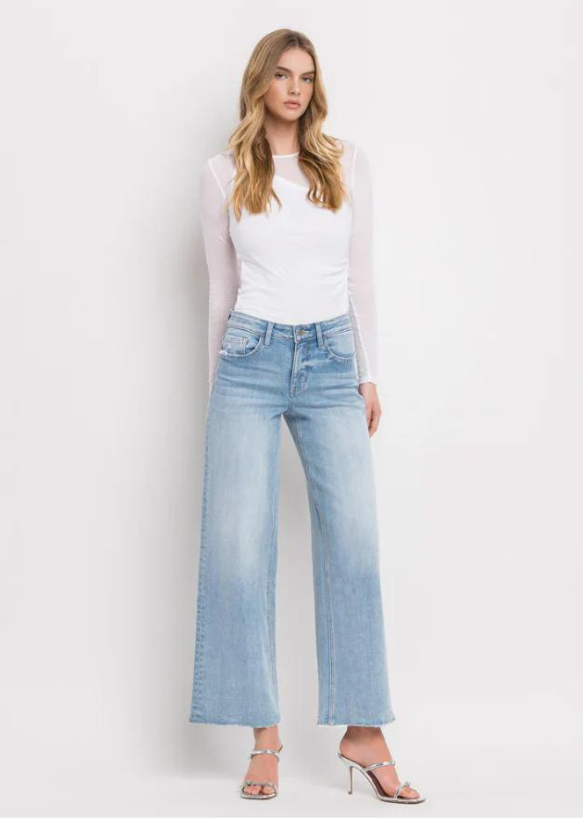 Vervet By Flying Monkey High Rise Wide Leg Jeans -Ben Rinnes. Crafted from comfort stretch denim, these jeans feature a high rise waist that flatters and a raw hem for a trendy touch. The full length and wide leg design offer both comfort and style, making these the perfect addition to any wardrobe.