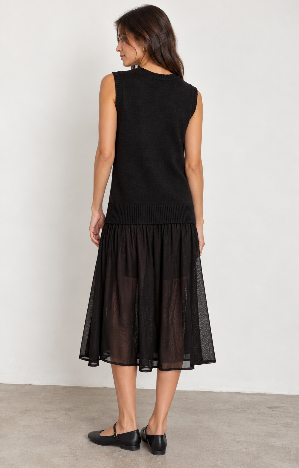 ICHI IHBANUS Dress in Black featuring a soft sleeveless knit bodice with a V-neckline, ribbed trim, and a lightweight sheer mesh midi skirt. Designed with a relaxed silhouette and contrasting textures for an effortlessly chic, feminine look.