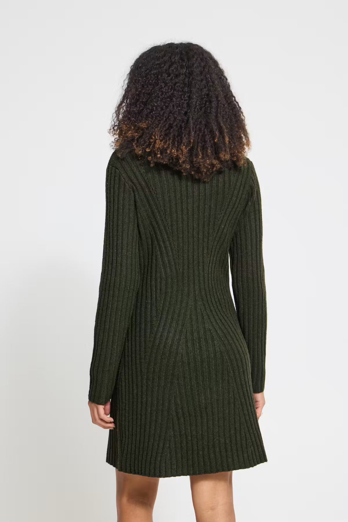 Rib-knit mini dress featuring a straight silhouette, classic round neckline, long sleeves, and a soft textured finish.