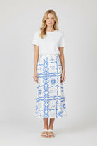 White skirt with blue abstract pattern on a white background
