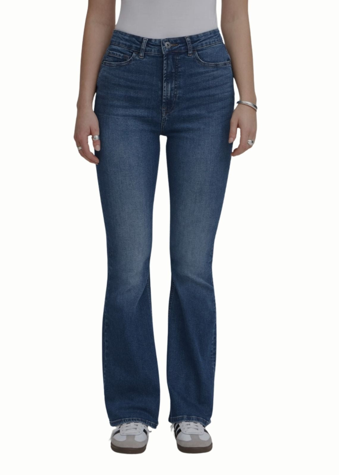 Blue jeans worn by a person on a white background