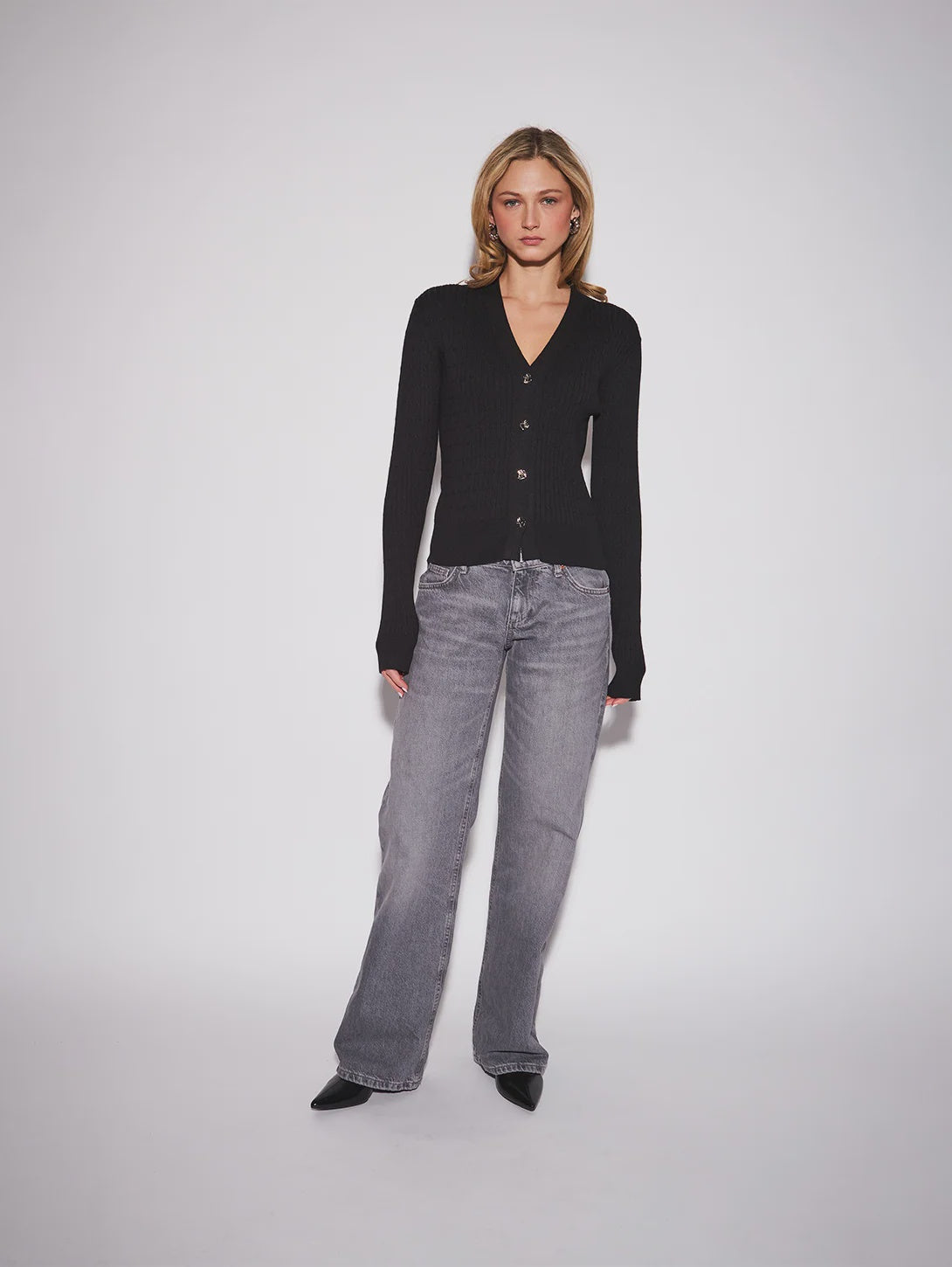 John & Jenn Maura Cardigan featuring a flattering V-neckline, delicate button-front closure, long sleeves, and a relaxed silhouette in a soft knit fabric for a polished, feminine look.