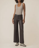 Coated wide-leg jeans featuring a sleek finish, Fab Ab front pockets, ankle-grazing length, and raw wide hems for a modern silhouette.