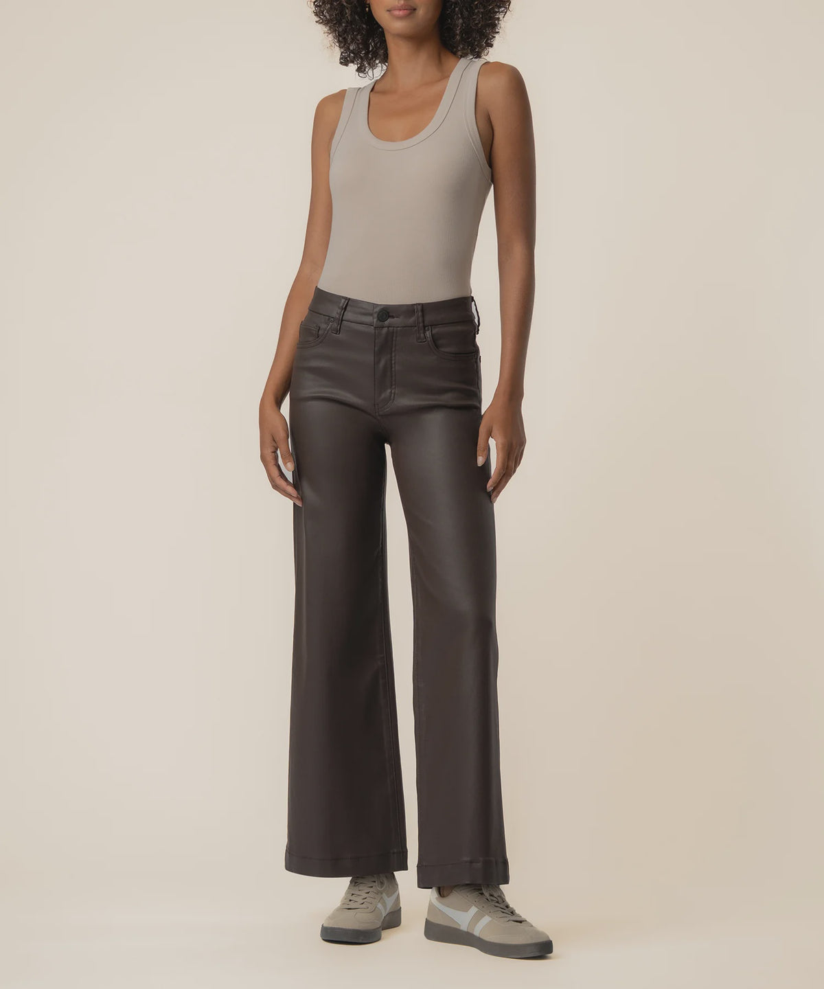 Coated wide-leg jeans featuring a sleek finish, Fab Ab front pockets, ankle-grazing length, and raw wide hems for a modern silhouette.