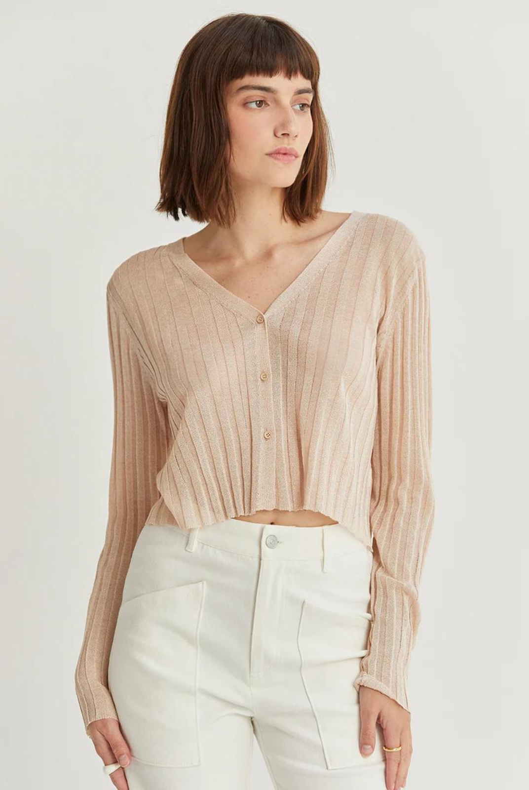 Leah Sheer Rib Cardigan. The Leah Sheer Rib Cardigan is a lightweight ribbed-knit cardigan featuring a V-neckline and long sleeves in a semi cropped length.