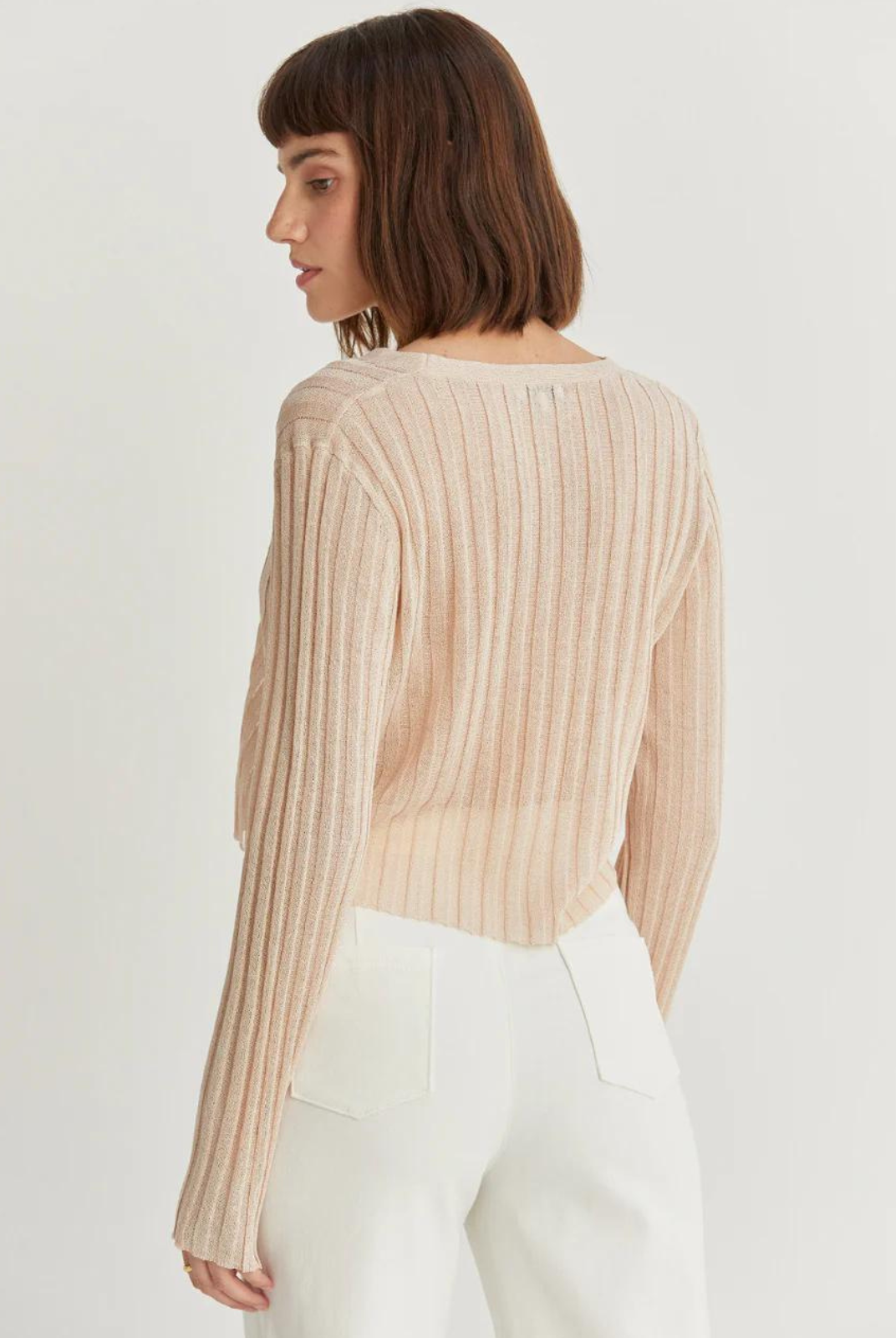 Leah Sheer Rib Cardigan. The Leah Sheer Rib Cardigan is a lightweight ribbed-knit cardigan featuring a V-neckline and long sleeves in a semi cropped length.